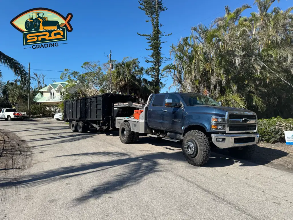 SRQ Grading tearing down a full residential structure in Venice using heavy machinery.