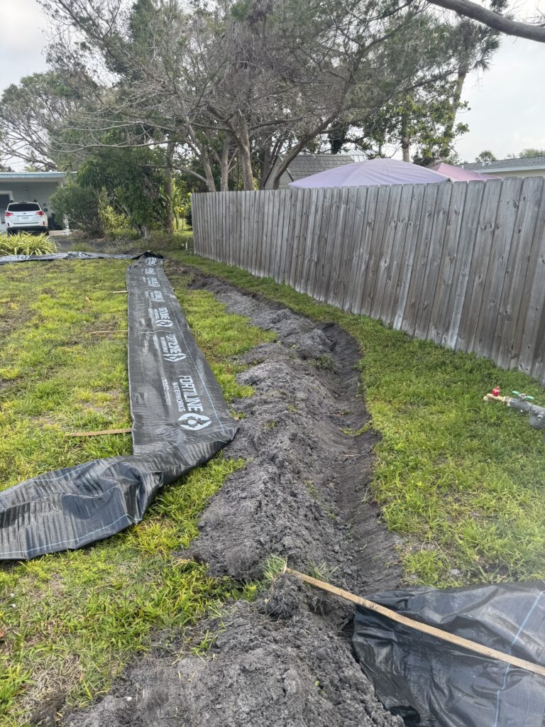 Close up of silt fence install on a residential demolition.