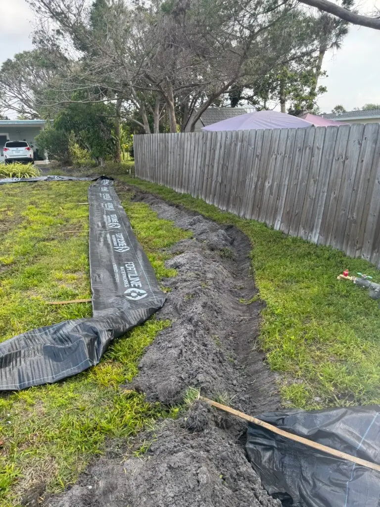 Close up of silt fence install on a residential demolition.